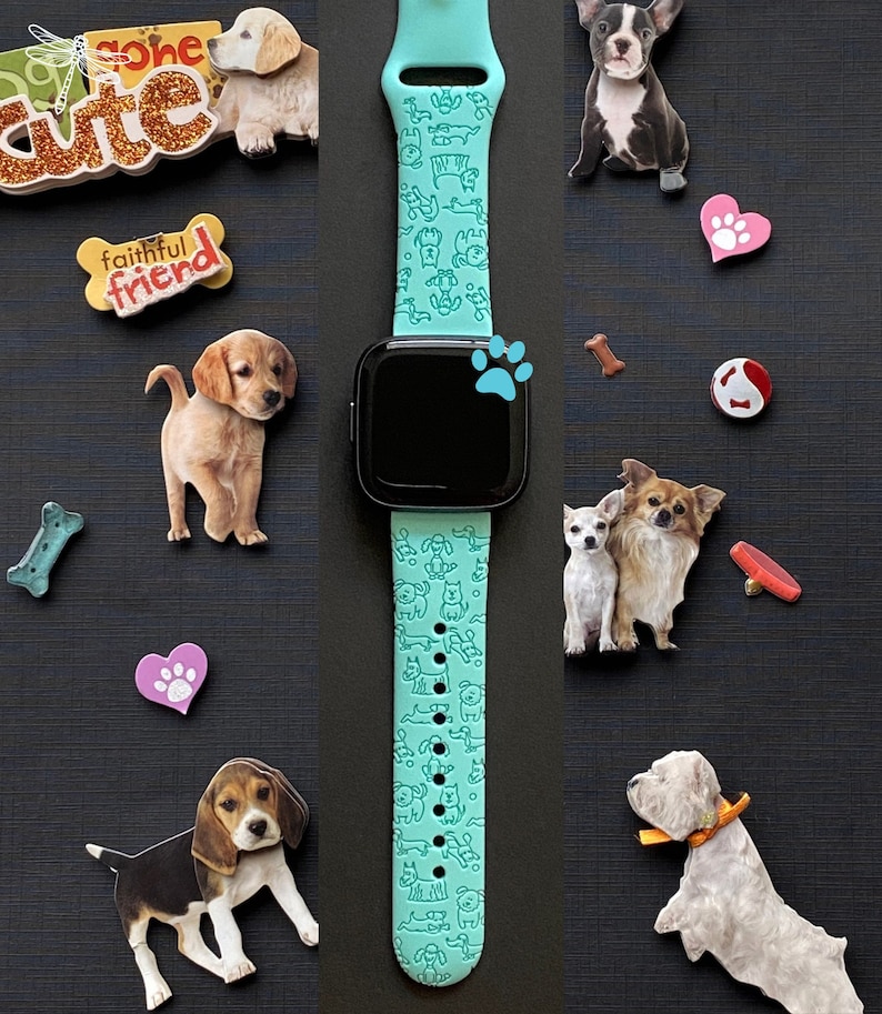 K&ouml;nnte beinhalten: Ein t&uuml;rkisfarbenes Smartwatch-Armband mit einer wei&szlig;en Umrandung verschiedener Hunderassen. Das Armband befindet sich auf einem schwarzen Hintergrund mit mehreren Hundestickern.