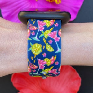May include: A blue silicone watch band with a colorful pattern of pink cocktails, lemons, and limes.