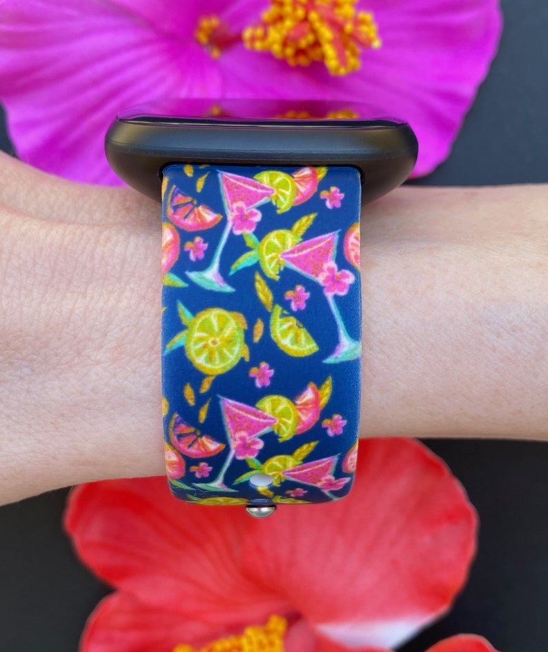 May include: A blue silicone watch band with a colorful pattern of pink cocktails, lemons, and limes.