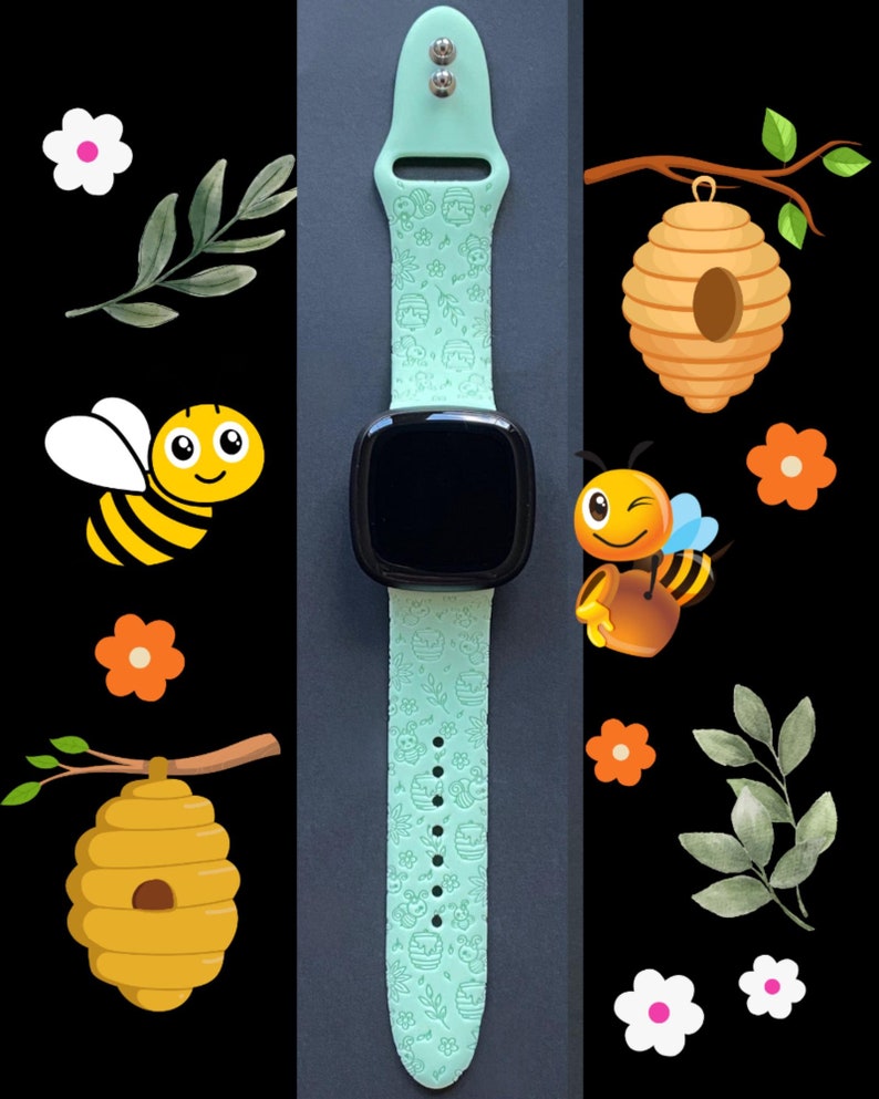 May include: A light green silicone watch band with a bee and honeycomb design. The band is compatible with smartwatches and has a black watch face.