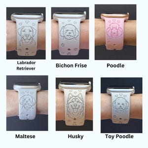 May include: A collection of engraved watch bands featuring different dog breeds. The bands are white, with detailed illustrations of a Labrador Retriever, Bichon Frise, Poodle, Maltese, Husky, and Toy Poodle. Each band has paw prints and hearts.
