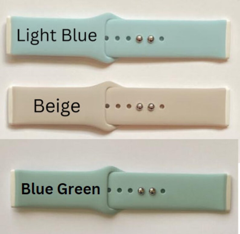 May include: Three silicone watch bands in light blue, beige, and blue green. Each band has a white buckle and silver metal accents.