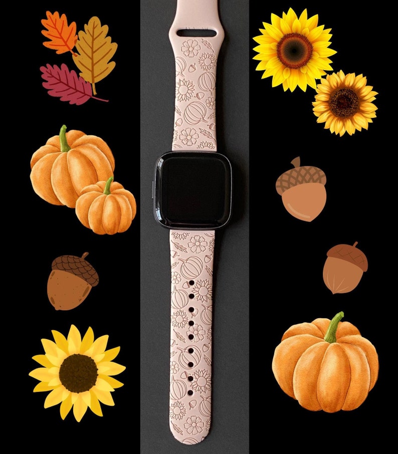 May include: A pink watch band with a fall-themed design. The band features pumpkins, sunflowers, acorns, and leaves.