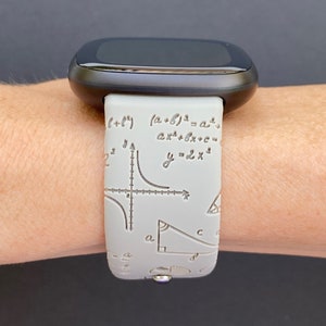 May include: A gray silicone watch band with a white mathematical formula print. The band features equations, graphs, and geometric shapes.