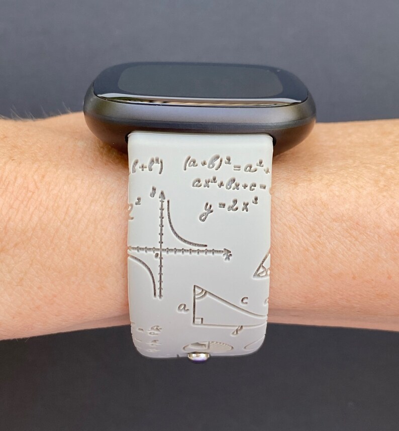 May include: A gray silicone watch band with a white mathematical formula print. The band features equations, graphs, and geometric shapes.