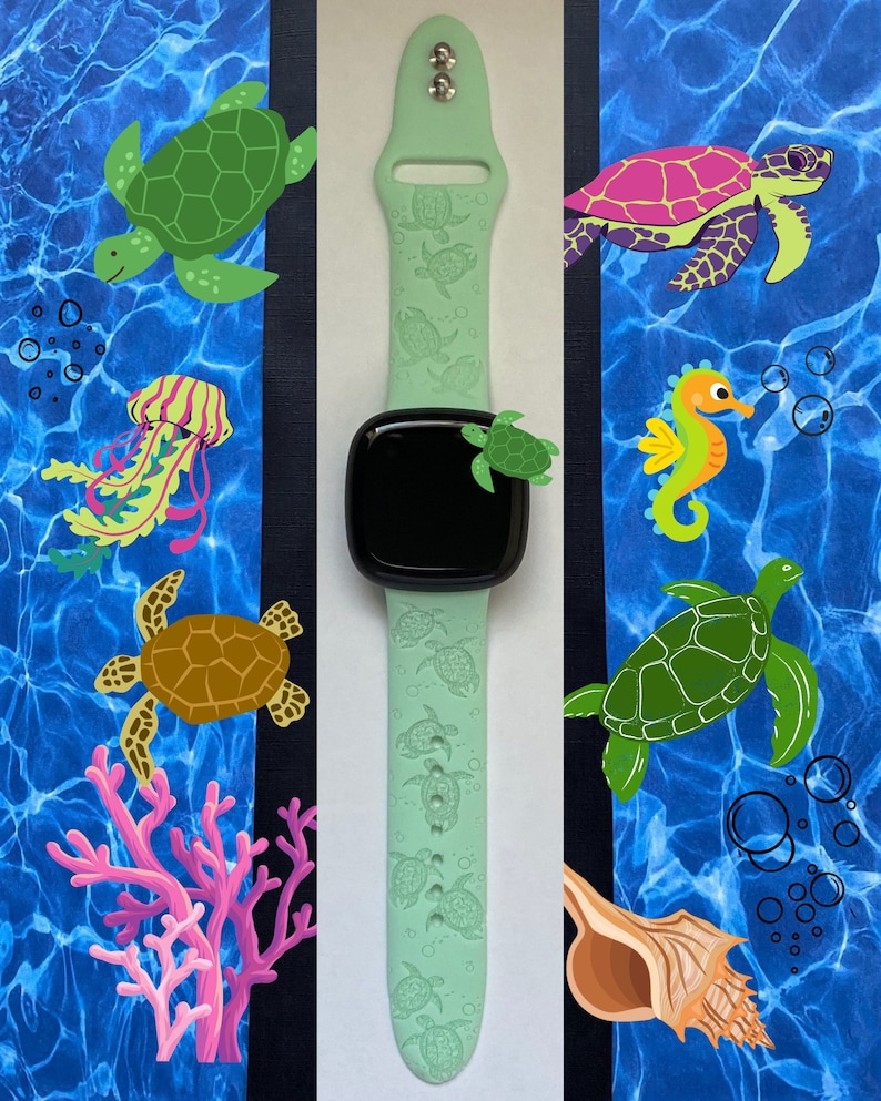 May include: A light green Apple Watch band with a sea turtle design. The band has a black watch face with a white outline. The band is surrounded by images of sea turtles, a seahorse, a jellyfish, coral, and a seashell.