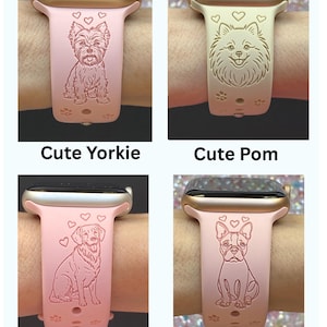 May include: Pink Apple Watch bands with engraved dog designs. The bands feature a Yorkie, Pomeranian, Golden Retriever, and Boston Terrier. Each band has hearts and paw prints. The text "Cute Yorkie", "Cute Pom", "Golden Retriever", and "Boston Terrier" is displayed.