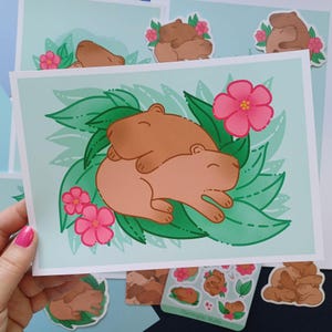 Impression d'art Capybara Cuddles Leaves A6 A5 A4 Carte postale Art mural