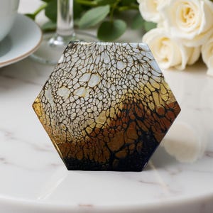 May include: A set of three ceramic mugs with a speckled, matte finish. Each mug is a different colour: light blue, cream, and grey. The mugs have a simple, modern design and a comfortable handle.