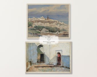 May include: Two watercolor paintings depicting scenes from a city in Morocco. The top painting shows a cityscape with white buildings and a blue sky. The bottom painting shows a courtyard with an archway and a red door.