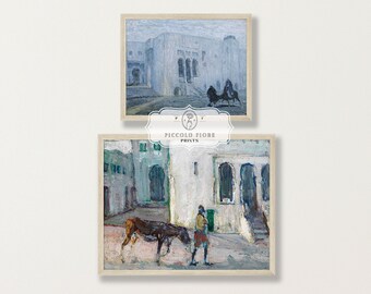 May include: Two framed paintings depicting scenes from a city in North Africa. The top painting shows a white building with a blue sky and a horse-drawn carriage. The bottom painting shows a man walking with a donkey in a courtyard.