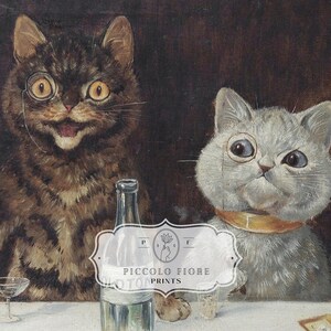 May include: Two cats wearing spectacles sit at a table with a bottle of alcohol and glasses. The cat on the left is brown and tabby, the cat on the right is white. The cats are looking at the viewer.