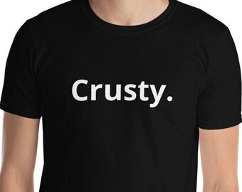 sarcastic black shirt, crusty shirt, funny tee, witty tee,  self deprecating T-shirt,  bold white text design saying “Crusty.”
