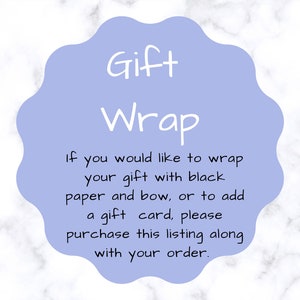 May include: A light blue circle with rounded edges and the text "Gift Wrap" in white. The text below reads "If you would like to wrap your gift with black paper and bow, or to add a gift card, please purchase this listing along with your order."