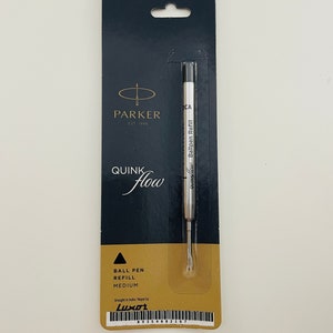 May include: A black and gold Parker Quink Flow ballpoint pen refill in a plastic package. The package has a hole at the top for hanging. The refill is labeled "QUINK flow Ballpen Refill" and "MEDIUM".