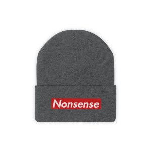 May include: Gray beanie with a red box and the word "Nonsense" in white letters.