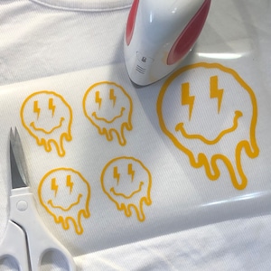 Iron on / HTV: Melting Smiley Face / Lighting Bolt Eyes Iron-On Decal / T-shirt Design/ D.I.Y Projects