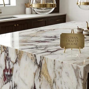 May include: A set of three ceramic nesting bowls in shades of blue, green, and white. The bowls have a speckled glaze and a simple, modern design. The largest bowl is about 15 cm in diameter.