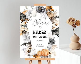 May include: A white welcome sign with black and orange floral accents. The sign reads "Welcome to Melissa's Baby Shower 10.31.20XX Come in, if you dare!"