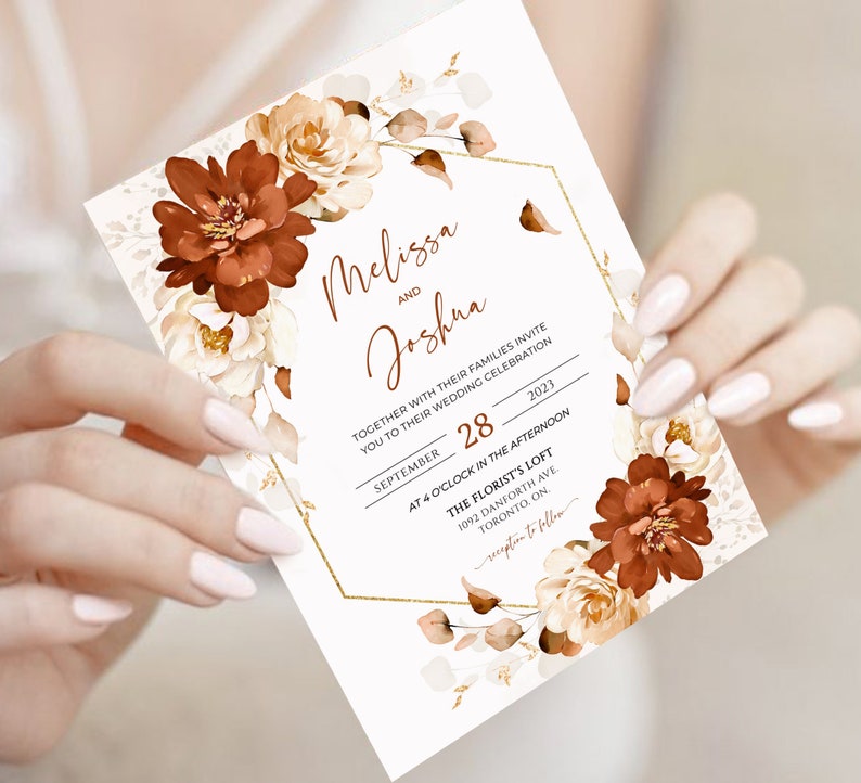 May include: Wedding invitation with a gold hexagonal frame and floral design. The invitation is for Melissa and Joshua's wedding on 28 September 2023 at 4:00 PM at The Florist's Loft in Toronto, Ontario.