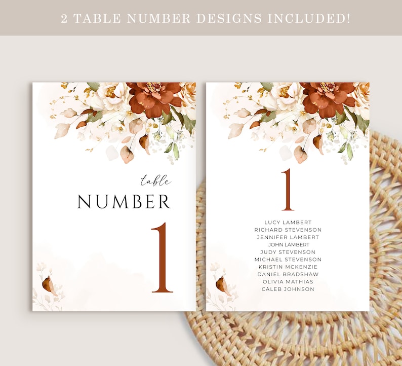 May include: Two printable table number cards with a floral design. The cards feature a watercolour illustration of white and orange flowers with green leaves. The text on the cards reads "table number 1".