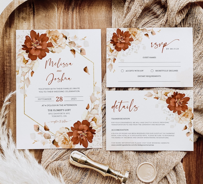 May include: Wedding invitation suite featuring a floral design with rust and cream coloured flowers. The invitation includes the names Melissa and Joshua, the date September 28, 2023, and the location The Florist's Loft. The RSVP card includes the date by 08.15.23 and the options to accept with joy or regretfully decline. The details card includes information about transportation and accommodation.