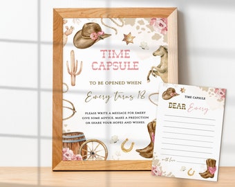 May include: A framed sign and card set with a Western theme, labelled "Time Capsule". The sign includes a cowboy hat, horse, and text. The card has lines for writing a message, with a cowboy boot illustration.