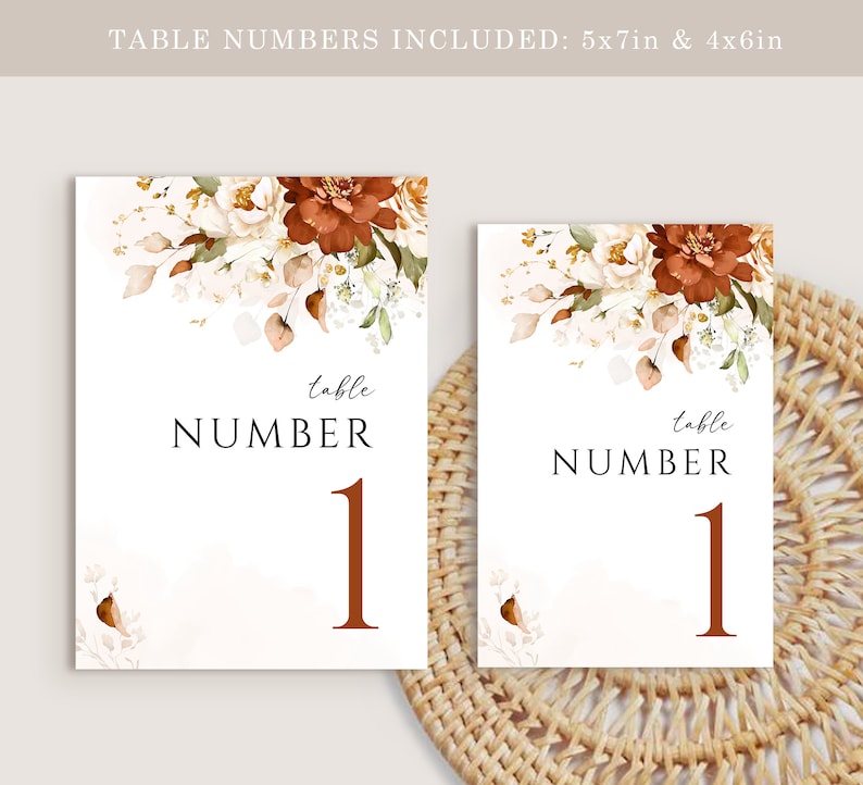 May include: Two white table number cards with a floral design in shades of brown, white, and green. The text "table number 1" is printed in brown on each card. The cards are 5x7 inches and 4x6 inches.