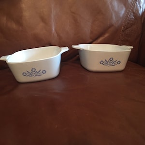 Two vintage Corning Ware casserole dishes (no lids) in the blue cornflower pattern