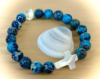 Pulsera con cruz de concha de jaspe de sedimento marino