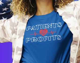 May include: A blue t-shirt with a white graphic that says "PATIENTS over PROFITS" with a red heart and a heartbeat line.