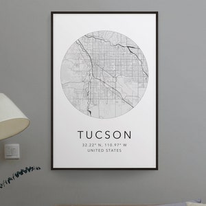 May include: Black and white print of a map of Tucson, Arizona, with the city name and coordinates "32.22° N, 110.97° W" and "UNITED STATES" printed below the map.