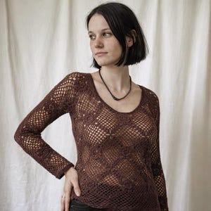 May include: A set of three ceramic mugs with a speckled, matte finish. The mugs are in shades of cream, light gray, and dark gray. Each mug has a simple, minimalist design and a rounded handle. Perfect for coffee or tea.