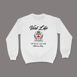 May include: White crewneck sweatshirt with the text "Vert Life" in a script font. Below the text is a crest with a red maple leaf and the words "True North Convertibles VIP Social Car Club Members Only."