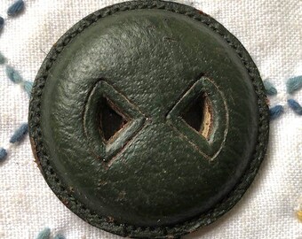 Dark green 3,7 cm leather button Czech triangle eyes 1930's