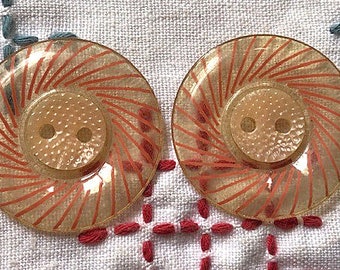 Pair 2 transparant celluloid buttons pink 1930's