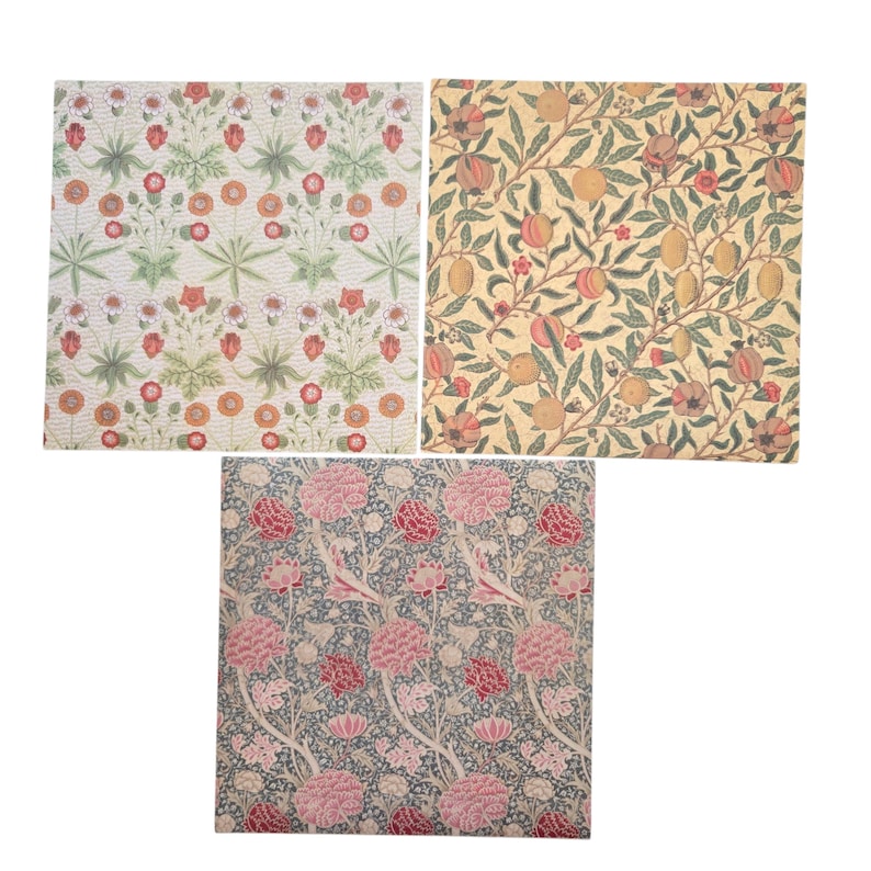 May include: Three square fabric swatches with floral and fruit patterns. One features orange and red flowers on a cream background. Another displays fruit and leaves on a yellow background. The third has pink flowers on a blue background.