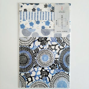 May include: A pack of origami paper featuring a variety of blue and white patterns. The paper is 15cm x 15cm and is made in Japan. The text on the label reads "Yuzen Washi Origami" and "Naguri Gama"