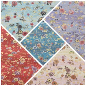May include: A collage of patterned paper samples featuring floral designs in various colors. The samples include shades of blue, red, purple, and cream, with gold accents. The floral patterns are reminiscent of traditional Japanese art.
