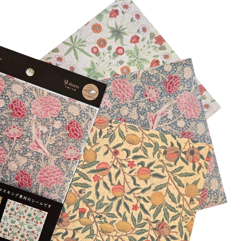 May include: A selection of patterned paper sheets with floral and fruit designs. The sheets feature pink, red, and orange flowers, and yellow and green fruit. The text "9 sheets" is visible on a black label.