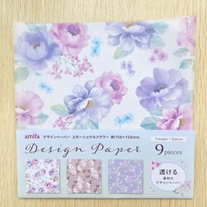 May include: Design paper featuring a floral pattern with large purple and pink flowers, smaller blue blossoms, and green leaves. The paper is approximately 5.9 x 5.9 inches and includes three designs with three pieces each.
