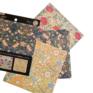 May include: A selection of patterned paper sheets with floral and bird motifs. The sheets display a range of colours, including navy, cream, and red. One sheet has the text "9 sheets". Ideal for scrapbooking and craft projects.