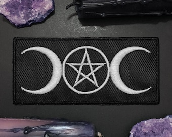 May include: Black fabric patch with white embroidery of a pentacle and triple moon symbol.