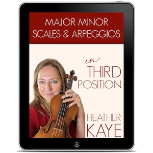 May include: A digital tablet screen displaying a red and white graphic with the text "MAJOR MINOR SCALES & ARPEGGIOS in THIRD POSITION HEATHER KAYE". A woman is holding a violin in the image.