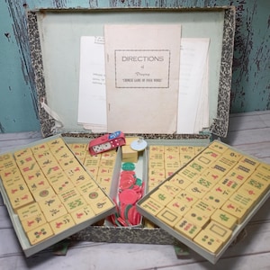 Vintage Mah Jong uit de jaren 50 set 148 butterscotch bakelieten tegels Mahjong Jongg in doos.