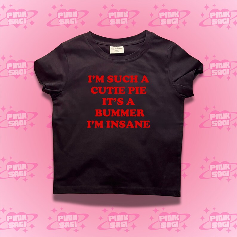 May include: Black t-shirt with red text that reads "I'm such a cutie pie it's a bummer I'm insane."