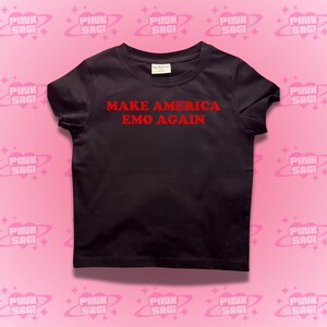 May include: Black t-shirt with red text that reads "Make America Emo Again".