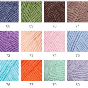 May include: A collection of 12 yarn skeins in various colors, including blue, green, brown, purple, pink, orange, and light blue. Each skein is labeled with a number from 68 to 80.