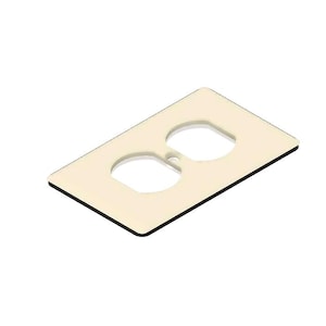 May include: A cream-colored electrical outlet cover with two openings for plugs. The cover has a black border.