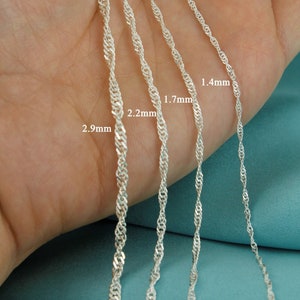 May include: Four silver rope chains of different thicknesses, laid out on a hand. The chains are labelled with their widths in millimetres: 2.9mm, 2.2mm, 1.7mm, and 1.4mm.